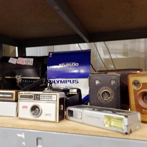 1212 - Mixed vintage cameras including Olympus, Kodak and Polaroid. Not available for in-house P&P