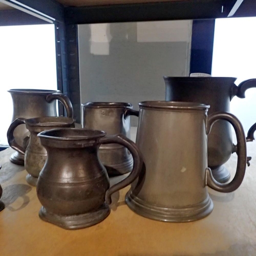 1242 - Eight pewter tankards in various sizes, largest H: 16 cm. Not available for in-house P&P