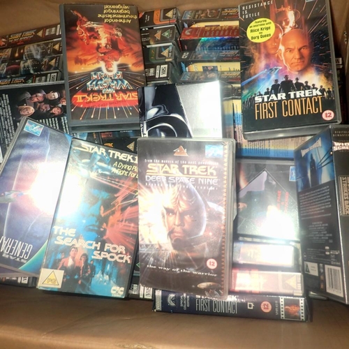 1945 - Fifty mixed Star Trek VHS tapes and a Star Wars trilogy box set. Not available for in-house P&P