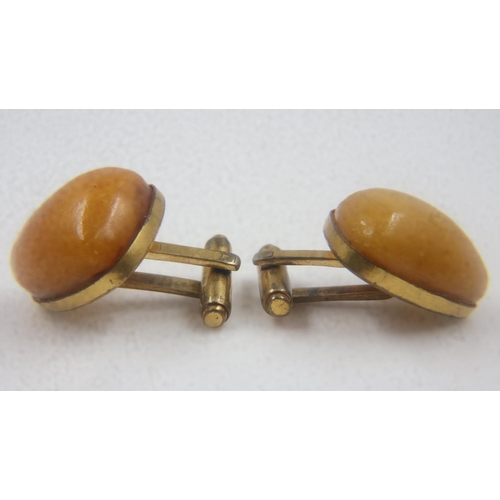 5 - 9ct gold mounted pair of butterscotch amber cufflinks, combined gross weight 11g. UK P&P Group 0 (£6... 