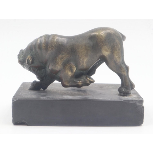 303 - Late 19th century bronze bull , unsigned, raised on a black marble plinth, overall 95 x 60 x 70mmH. ... 