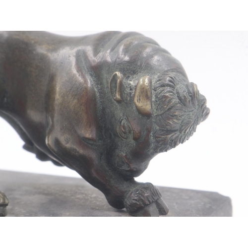 303 - Late 19th century bronze bull , unsigned, raised on a black marble plinth, overall 95 x 60 x 70mmH. ... 