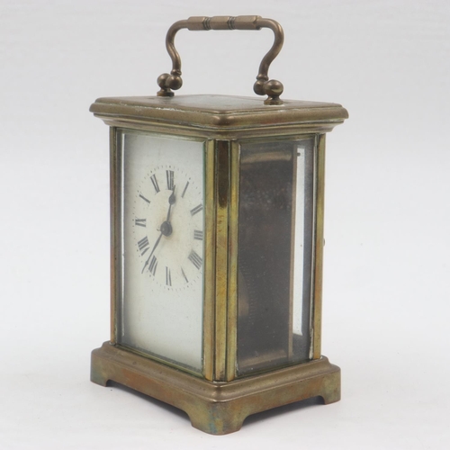 318 - Brass carriage clock with bevelled glass to five sides, overall H: 14 cm. Not available for in-house... 