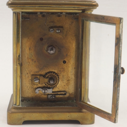 318 - Brass carriage clock with bevelled glass to five sides, overall H: 14 cm. Not available for in-house... 