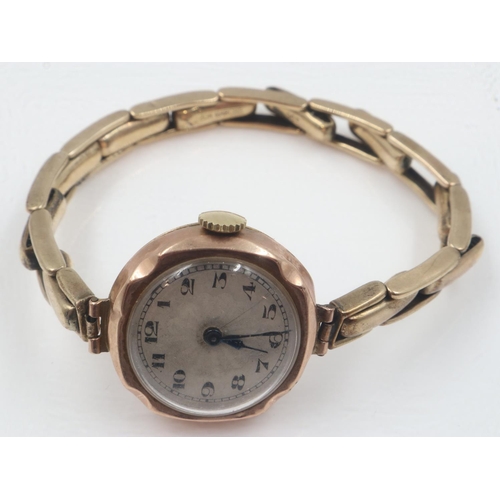 100C - 9ct gold cased ladies wristwatch on a sprung 9ct gold expanding bracelet, working at lotting. UK P&P... 