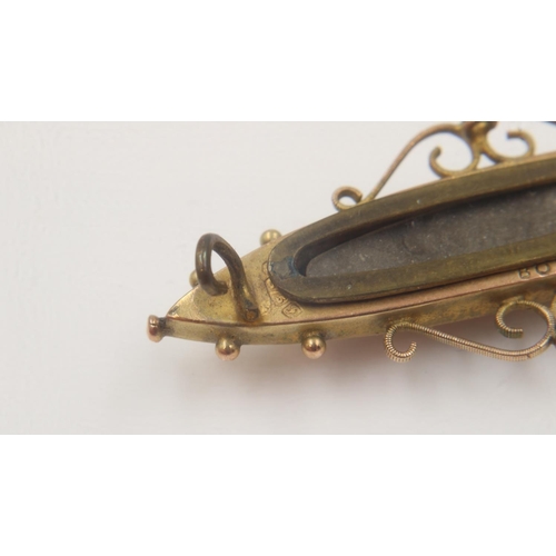 90C - Victorian 9ct gold mourning brooch, stone set, with glass back, L: 45mm, 4.0g. UK P&P Group 0 (£6+VA... 