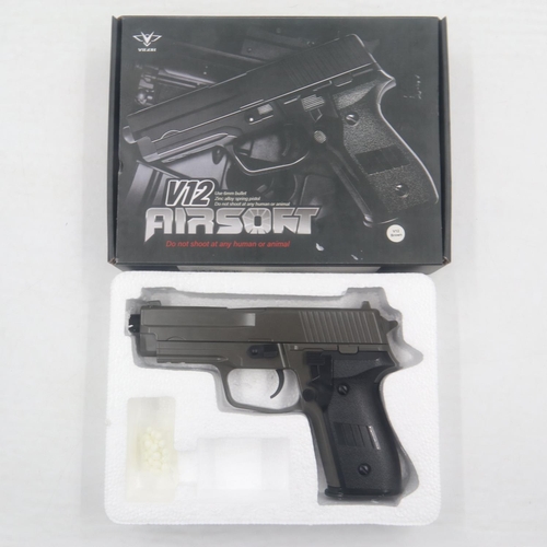 2011 - Airsoft pistol, model V12 in brown, boxed. P&P Group 2 (£18+VAT for the first lot and £3+VAT for sub... 