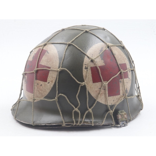 2092 - WWII US front-seam M1 Medics Helmet with Firestone liner and camouflage net. UK P&P Group 2 (£20+VAT... 