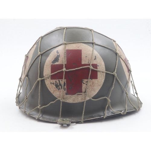 2092 - WWII US front-seam M1 Medics Helmet with Firestone liner and camouflage net. UK P&P Group 2 (£20+VAT... 