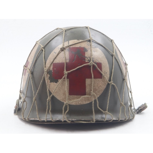 2092 - WWII US front-seam M1 Medics Helmet with Firestone liner and camouflage net. UK P&P Group 2 (£20+VAT... 