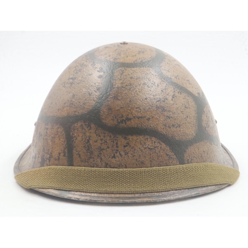 2093 - British 1944 Pattern Turtle helmet, painted in Maltese Rubble camouflage. Malta was one of the heavi... 