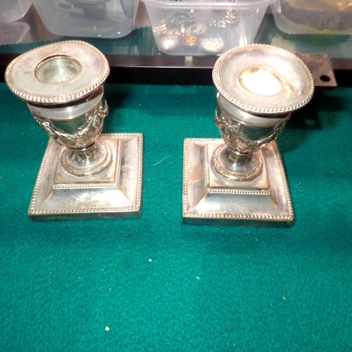 1075 - Pair of stub silver plated candlesticks with garland decorations. UK P&P Group 1 (£16+VAT for the fi... 