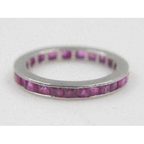 24 - Unmarked 18ct white gold and ruby full eternity ring, size N, 3.5g. UK P&P Group 0 (£6+VAT for the f... 