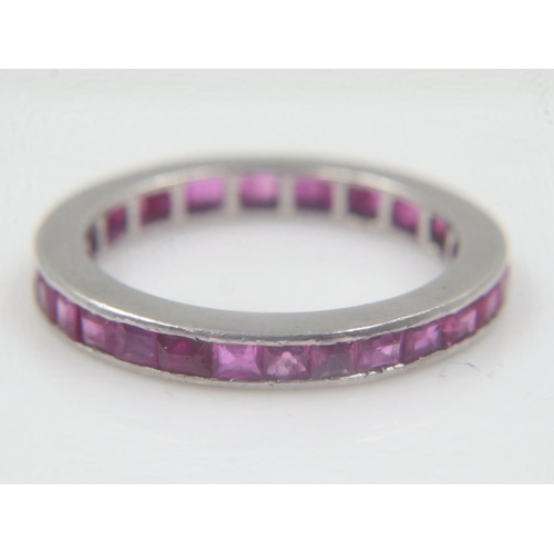 24 - Unmarked 18ct white gold and ruby full eternity ring, size N, 3.5g. UK P&P Group 1 (£16+VAT for the ... 