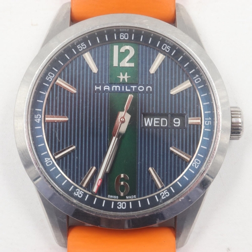 42 - HAMILTON: gents steel cased wristwatch, with baton and Arabic chapters against a two-tone blue and g... 