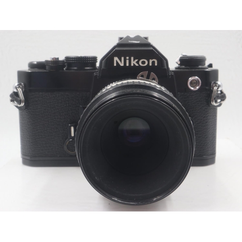 81 - Nikon FM film camera and lens. UK P&P Group 2 (£20+VAT for the first lot and £4+VAT for subsequent l... 