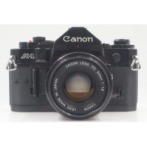 91 - Canon A1 and F18 lens. UK P&P Group 1 (£16+VAT for the first lot and £2+VAT for subsequent lots)