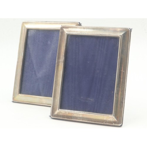 63 - Pair of rectangular silver easel photograph frames, aperture 85 x 120 mm, overall 115 x 150 mm. UK P... 