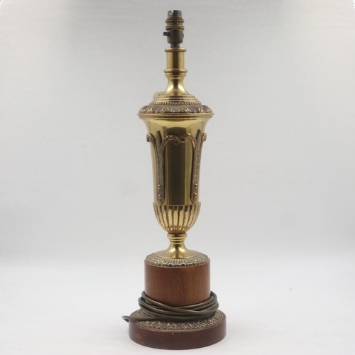 254 - Large brass table lamp on a turned wooden base, H: 38 cm. All electrical items in this lot have been... 