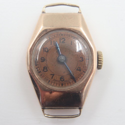 35 - UNO: ladies 9ct gold manual wind wristwatch head, Roman chapters against a two-tone burnt orange and... 