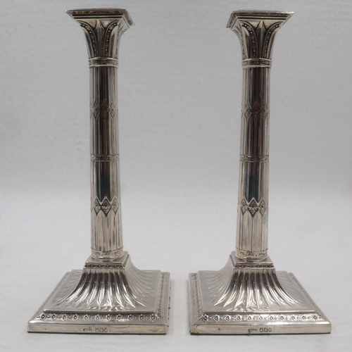 74 - Pair of hallmarked silver Doric candlesticks, weighted, H: 28 cm, maker James Dixon and Sons. UK P&P... 