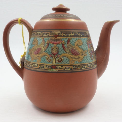 165 - In the manner of Dr Christopher Dresser for Watcombe Pottery, a terracotta teapot and cover decorate... 