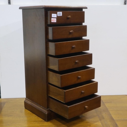 223 - Small seven drawer chest, W: 35 cm, H: 80 cm. All drawers open and close easily, slight crack in top... 