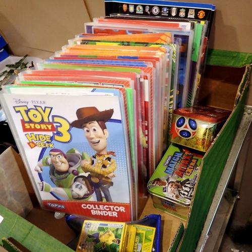 1060 - Twenty folders of mixed trading cards to include Lego Ninja and Toy Story etc, contents unchecked. N... 