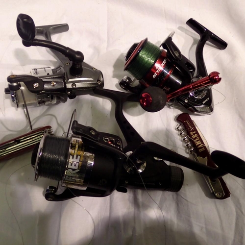 1119 - Two penknives and three fishing reels. Not available for in-house P&P