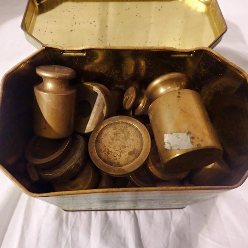 1201 - Vintage tin containing assorted brass weights. Not available for in-house P&P