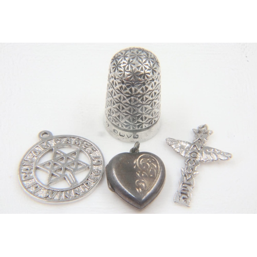 19 - Charles Horner silver thimble and three silver charms. UK P&P Group 0 (£6+VAT for the first lot and ... 