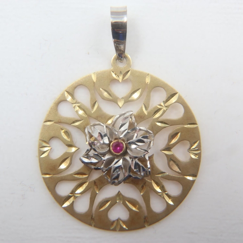 31 - Large 14ct white and yellow gold circular pendant set with a ruby, D: 35 mm, 5.3g. UK P&P Group 0 (£... 