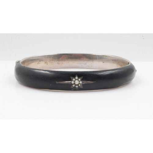 46 - Antique black enamel, seed pearl and silver mourning bangle, 68 x 51 mm. UK P&P Group 0 (£6+VAT for ... 