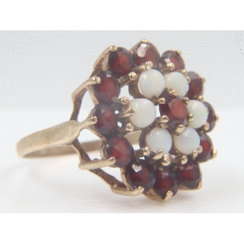 48 - 9ct gold garnet and opal set target ring, size Q, 4.4g. UK P&P Group 0 (£6+VAT for the first lot and... 