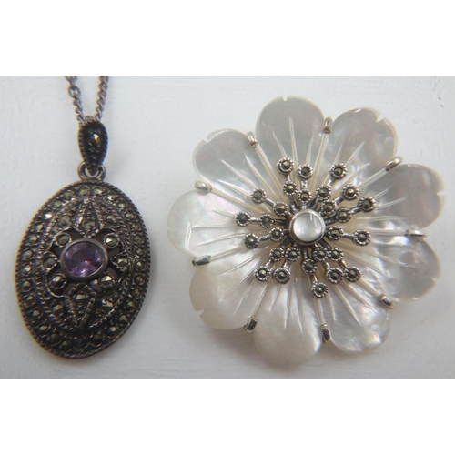 58 - Silver and mother of pearl flower brooch, D: 35 mm, and a silver and marcasite pendant necklace. UK ... 