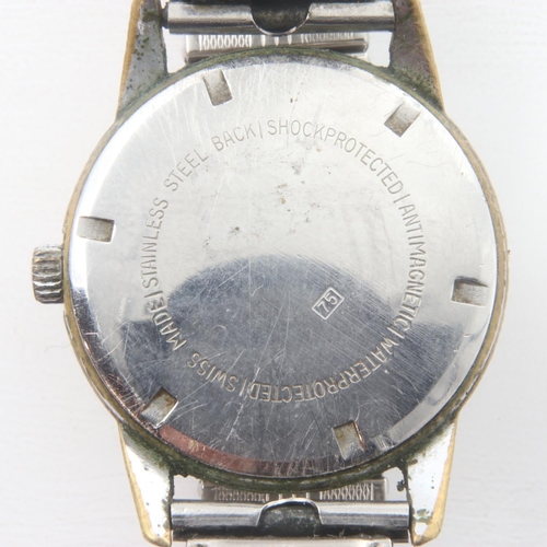 93 - ENSIGN: gents manual wind wristwatch, chromium plated case with champagne dial, working at lotting, ... 