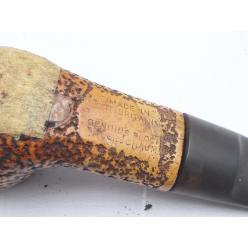 166 - Four mixed smoking pipes including Petersons of Ireland and a meerschaum example, on a ceramic pipe ... 