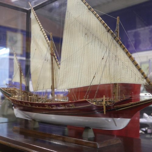 335 - Scratch built wooden three masted sailing vessel in a glass case, L: 70 cm. Not available for in-hou... 