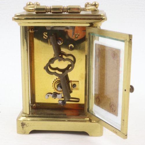 340 - Brass carriage clock with key, working at lotting. UK P&P Group 2 (£20+VAT for the first lot and £4+... 