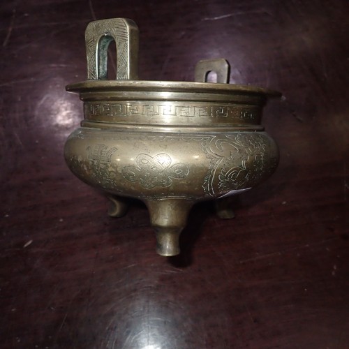 301 - Chinese bronze censer, raised on three supports with engraved decoration and impressed six character... 