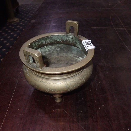 301 - Chinese bronze censer, raised on three supports with engraved decoration and impressed six character... 