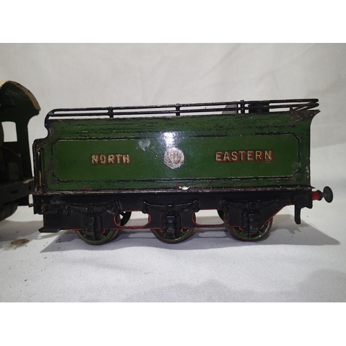 2158 - Unboxed, play worn Bassett Lowke O gauge 4-4-0 clockwork North Eastern 1242 and tender, some parts m... 