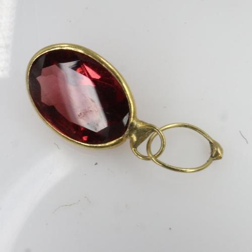 25 - Natural oval cut garnet in 9ct gold bezel setting, drop L: 10 mm, 0.1g. UK P&P Group 0 (£6+VAT for t... 