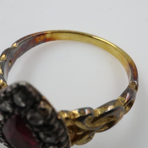 35 - Unmarked 19th century 18ct gold ring set with pear shaped ruby in foiled back setting with rose cut ... 