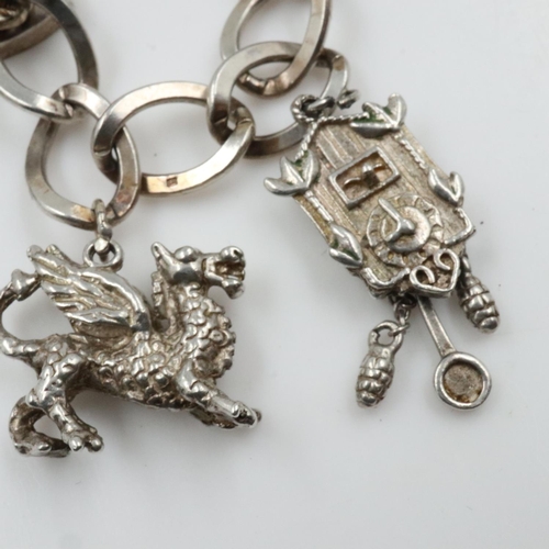 50 - Silver charm bracelet with ten charms, 38g. UK P&P Group 0 (£6+VAT for the first lot and £1+VAT for ... 