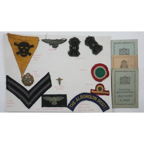 2218 - Small collection of WWII cloth badges and insignia mounted on card, with three ID cards. UK P&P Grou... 