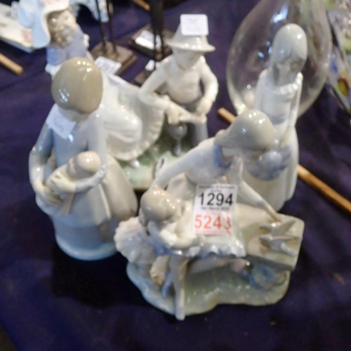 1294 - Four ceramic figures including three Nao figures. Not available for in-house P&P