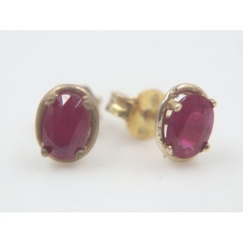 13 - Pair of silver gilt ruby-set studs. UK P&P Group 0 (£6+VAT for the first lot and £1+VAT for subseque... 