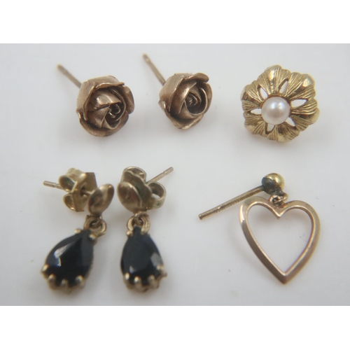 33 - Two pairs of 9ct gold earrings and two odd 9ct gold earrings, some stone-set, combined 4.4g. UK P&P ... 