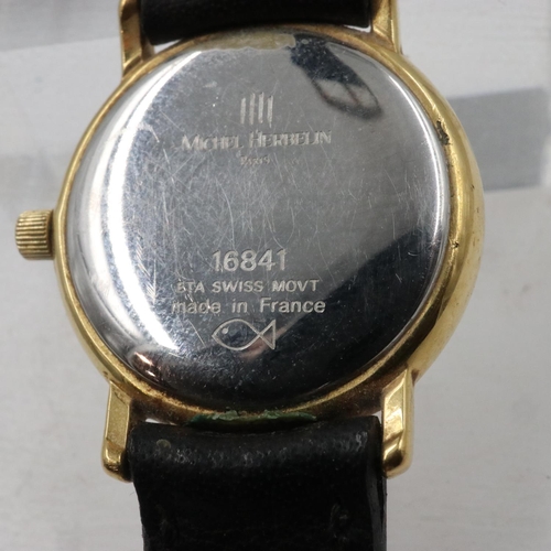 62 - MICHEL HERBELIN: Ladies gold plated wristwatch, white dial with Roman chapters and date aperture, ba... 